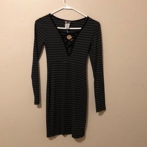Gray and black striped dress with unique neckline